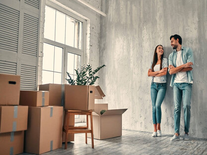 Professional movers carrying a sofa